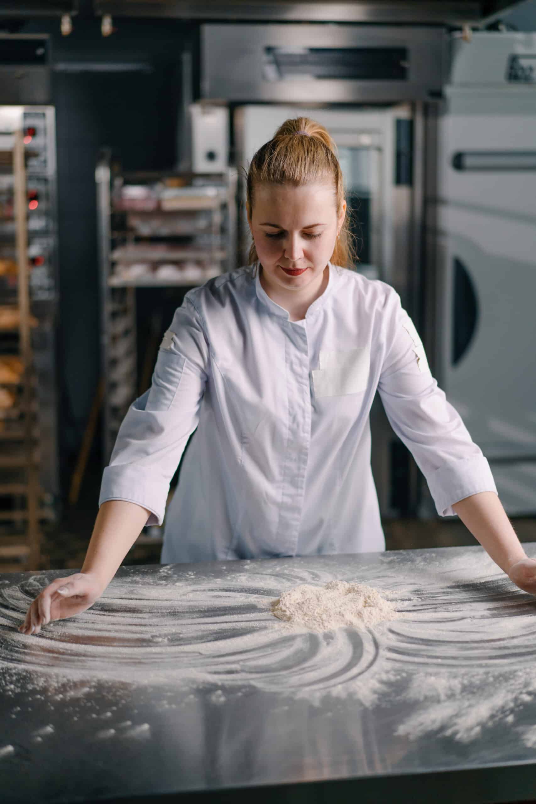 professional chef throws flour on table stirs it b 2024 12 04 15 11 44 utc scaled